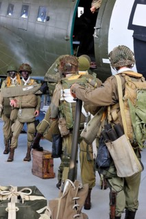 Uniforms of American soldiers and Douglas C-47 aircraft in the Airborne Museum in