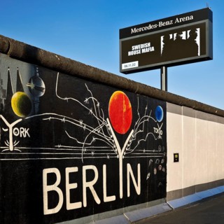 Mural entitled Berlyn on a remnant of the Berlin Wall, artist Gerhard Lahr, with advertising, East