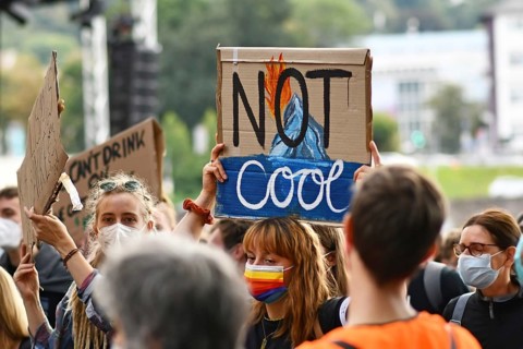 Heidelberg, Germany, 24th September 2021: Sign held up by young woman saying 'Not cool' at Global