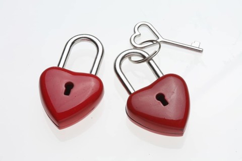 Small red padlocks with a heart-shaped key