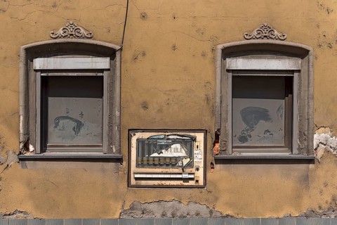 Old cigarette machine in the wall of an old house, Eltmann, Lower Franconia, Bavaria, Germany,