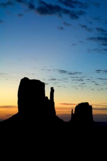 Rock formation the Mittens, sandstone rocks silhouetted at sunset, Monument Valley Navajo Tribal