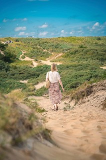 Tourist on sandy path through the National Park, Kennemerland National Park, Zandvoort, Netherlands