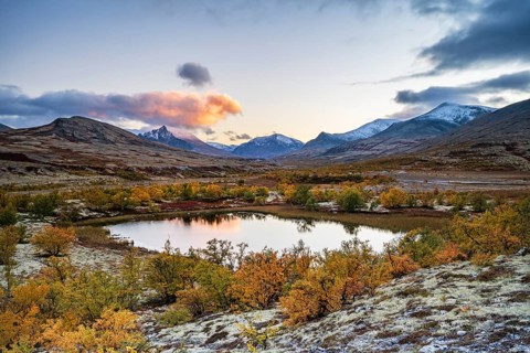 Mountains and lake in autumnal mountain landscape, Rondane National Park, Norway, Europe