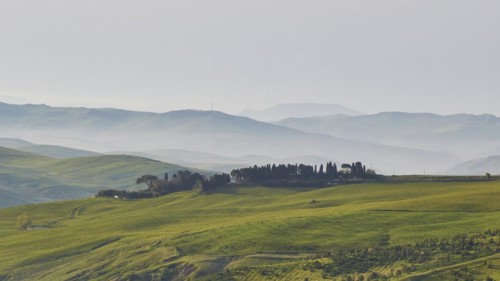 Fog, ranges of hills, green meadows, small woods, Madonie National Park, spring, Sicily, Italy,