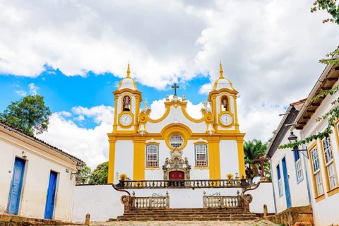 Houses and historic church in an old cobbled street in the famous city of Tiradentes in Minas
