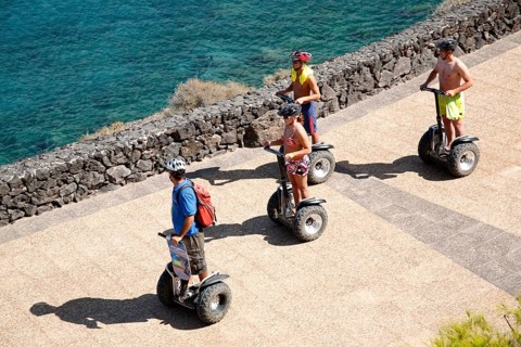 Tourists taking a ride with Segway Personal Transporters along the sea, Lanzarote, Canary Islands,