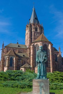 Old Gothic abbey church with monk Paul in Wissembourg, Alsace, France, Europe