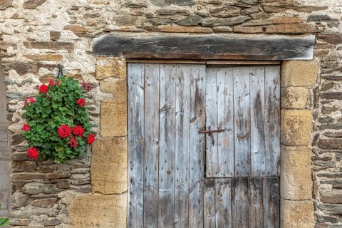 Old wall of a house in the village of Estaing. Aveyron. France