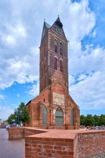 Ruin of St. Mary's Church with bricked-up ground plan and steeple, historic old town Hanseatic city