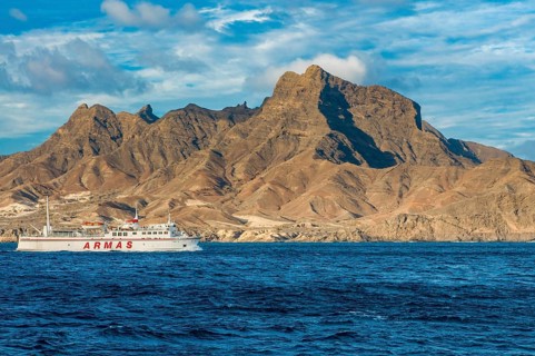 Ferry in the sea, mountains in background. San Vincente. Mindelo. Cabo Verde. Africa
