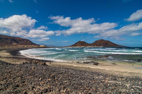 Vulcanic cone and beach with pebbles. San Vincente. Cabo Verde. Africa