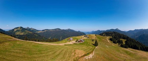Drone shotMountain landscape, alpine meadow with alpine huts on the Feichtensteinalm, Hintersee,