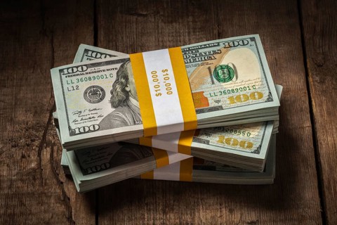 Creative business finance making money concept, stacks of new 100 US dollars 2013 edition banknotes