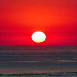 Reflection at sunset, deformation, unusual deformation in haze, Bassin d'Arcachon, Bay of Biscay,
