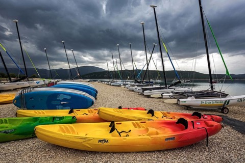 Boats on the beach in Sainte Croix du Verdon, Lac de Sainte-Croix, thunderstorm atmosphere,