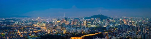 Panorama of Seoul downtown cityscape illuminated with lights and Namsan Seoul Tower in the evening