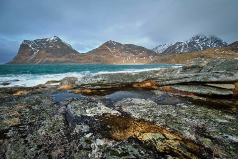 Rocky coast of fjord of Norwegian sea in winter. Lofoten islands, Norway, Europe