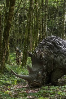Diorama showing Neanderthal hunter chasing woolly rhinoceros (Coelodonta antiquitatis) at Prehisto