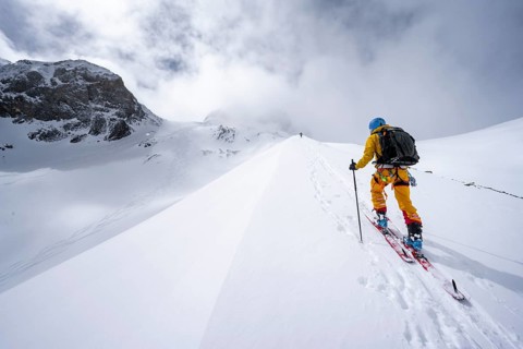 Ski tourers in a snowy mountain landscape, ascent to the Wildhorn, cloudy mood, high tour, Bernese