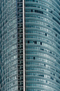 Madrid, Spain, February 7, 2021: Full frame of glass facade of skyscraper in Cuatro Torres