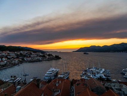 Evening atmosphere at sunset by the sea, view from the bell tower, Korcula harbour, Korcula island,