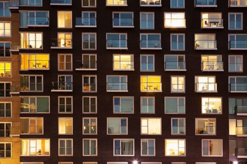 Modern apartment building at dusk