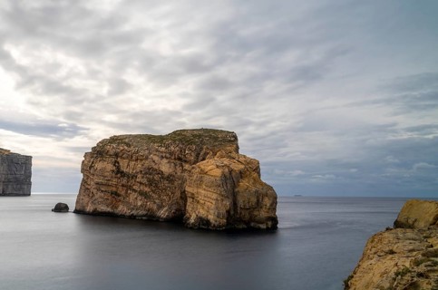 Long exposure landscape view of Dwejra Bay and Ufo Rock on Gozo Island in Malta
