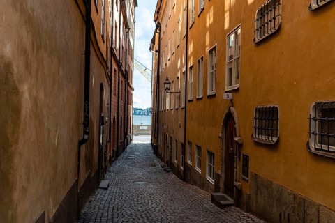 View of narrow cobblestoned street in Gamla Stan, the medieval Old Town of Stockholm