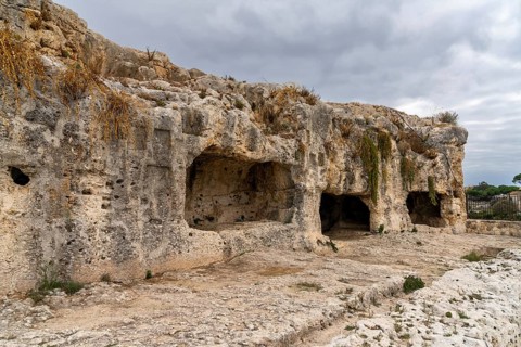Syracuse, Italy, 28 December, 2023: view of the Caves of Nymphaeum in the Neapolis Archaeological