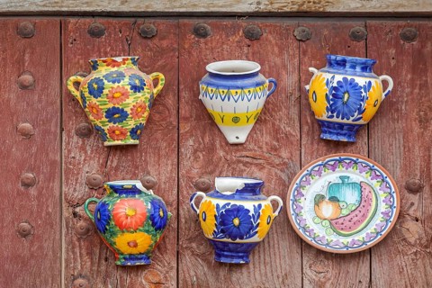 Traditional ceramics on an old wooden gate, damaged, 2nd choice, Frigiliana, Andalusia, Spain,