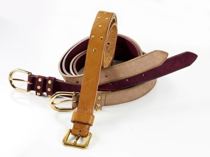 Leather belt in front of a white background, studio shot