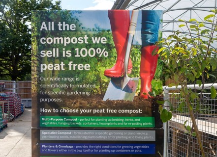 Sign advertising 100% peat free compost, Notcutts garden centre, Woodbridge, Suffolk, England, UK