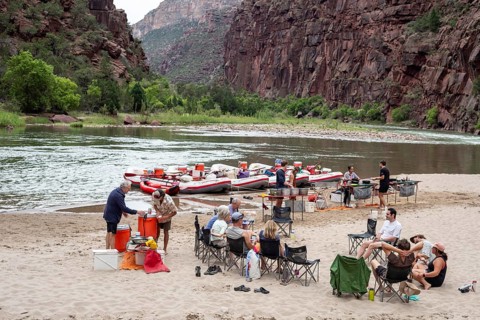 Dinosaur, Colorado, River rafters relax in the evening during a trip on the Green River in Dinosaur