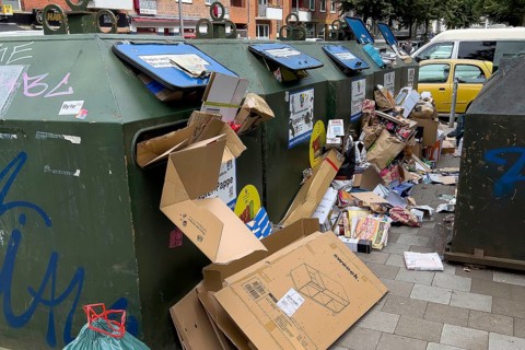 Overflowing paper containers in Hamburg, waste containers, recyclables containers, recyclables,