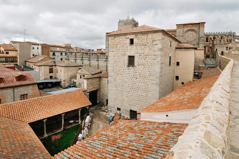 Avila, Spain, November 11, 2014: The Medieval Walls of Avila and the cathedral. Cloudy day. The old