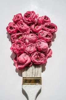 Paint brush drawing with pink flowers on white background. The concept of spring and international