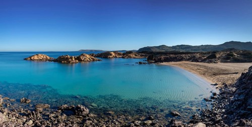 Landscape view of the idyllic and peaceful Cala Pregonda in northern Menorca