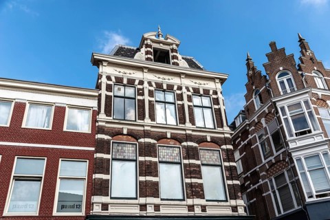 Haarlem, Netherlands, May 07, 2022: Low angle view of traditional Dutch houses in historic centre