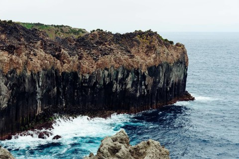 Cliffs in the north coast of Terceira Island, Azores, Portugal. CLoudy day of summer