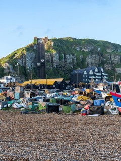 Hastings, East Sussex, England, UK, May 11, 2022: The pebble beach and East Hill Cliff Railway