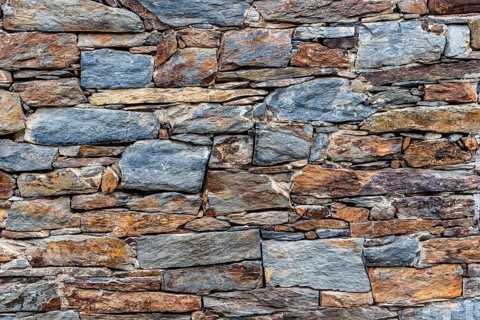 Slate slabs texture background. Pattern of black slate wall