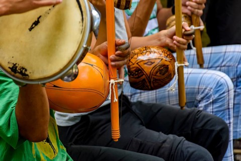 Afro Brazilian percussion musical instruments during a capoeira performance in the streets of