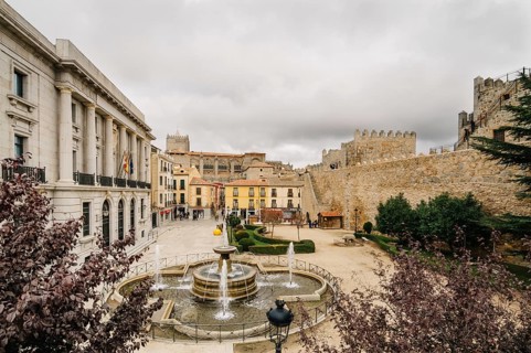 Avila, Spain, November 11, 2014: The Medieval Walls of Avila, cathedral and square. The old city