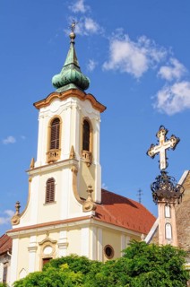 Memorial cross and the bell tower of the St John Roman Catholic Parish Church, Szentendre, Hungary,
