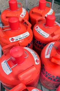 Red gas cylinders with propane gas, Allgäu, Bavaria, Germany, Europe