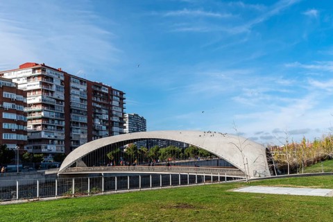 Madrid, Spain, December 9, 2019: Modern concrete bridge over Manzanares River in Madrid RIo area,