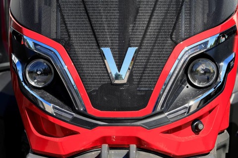 Valtra logo on the front of a red, modern Valtra farm tractor. Salo, Finland. June 23, 2024