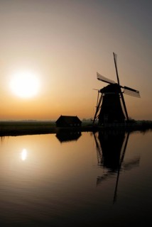 Achtkante mill near Groot-Ammers in the Dutch region Alblasserwaard in backlight