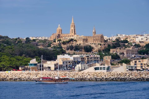The Ghajnsielem Parish Church and the Our Lady of Lourdes Church high above the harbour, Mgarr,